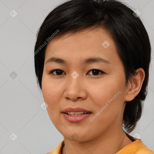 Joyful asian young-adult female with medium  brown hair and brown eyes