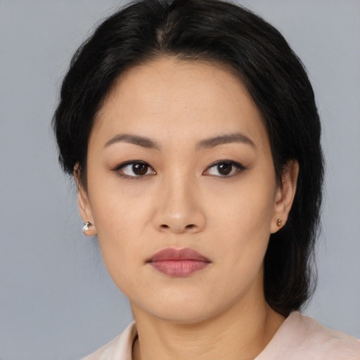 Neutral asian young-adult female with medium  black hair and brown eyes