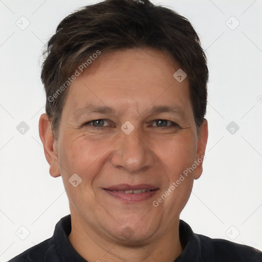 Joyful white adult male with short  brown hair and brown eyes