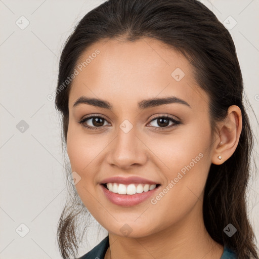 Joyful white young-adult female with long  brown hair and brown eyes