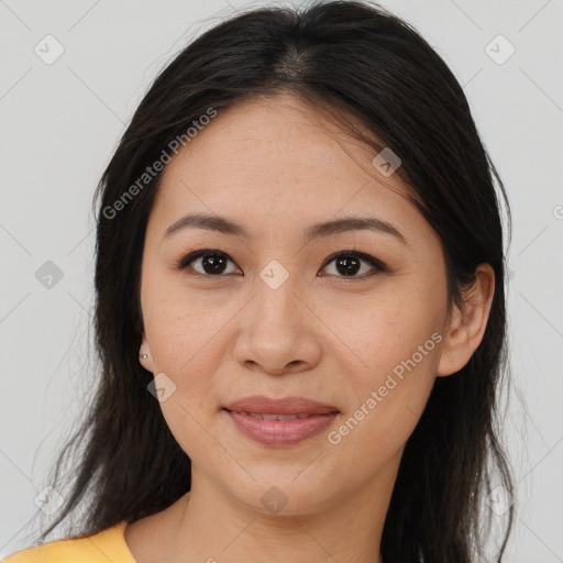 Joyful asian young-adult female with long  brown hair and brown eyes