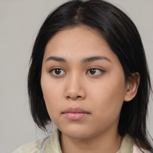 Neutral asian young-adult female with medium  black hair and brown eyes