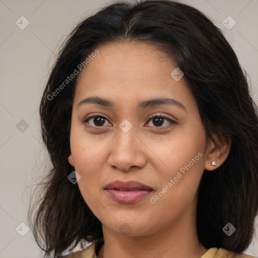 Joyful latino young-adult female with medium  brown hair and brown eyes