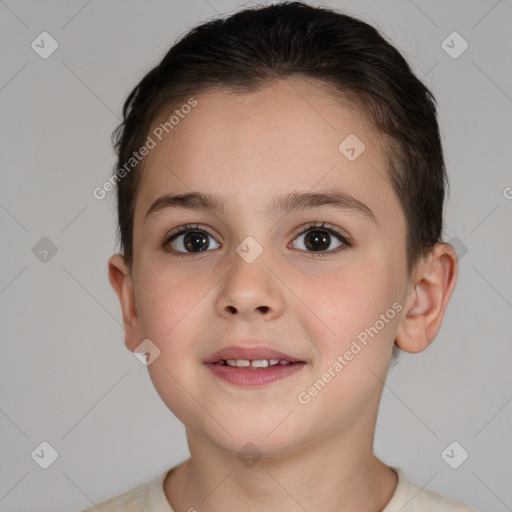 Joyful white child female with short  brown hair and brown eyes