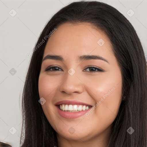 Joyful white young-adult female with long  black hair and brown eyes