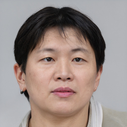 Neutral asian adult male with short  brown hair and brown eyes