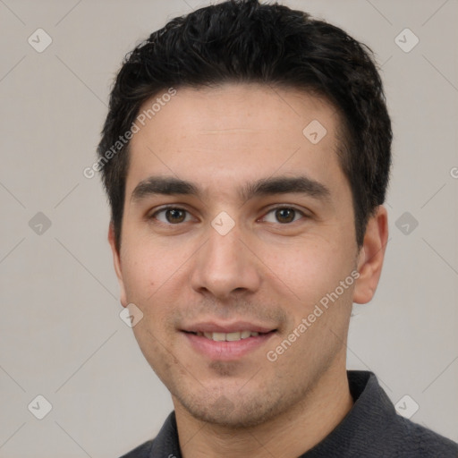 Joyful white young-adult male with short  black hair and brown eyes