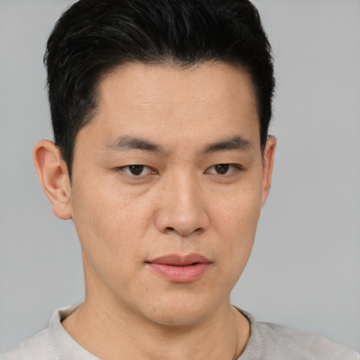 Neutral asian young-adult male with short  brown hair and brown eyes