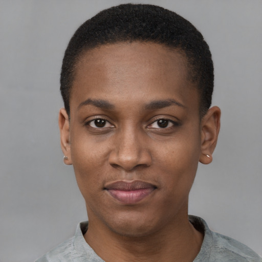 Joyful black young-adult female with short  black hair and brown eyes