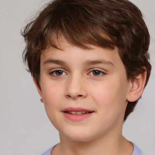 Joyful white child male with short  brown hair and brown eyes