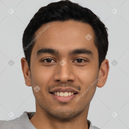 Joyful latino young-adult male with short  black hair and brown eyes