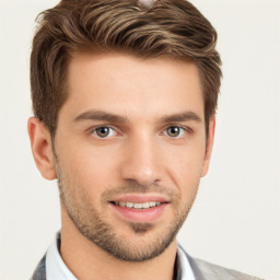 Joyful white young-adult male with short  brown hair and grey eyes