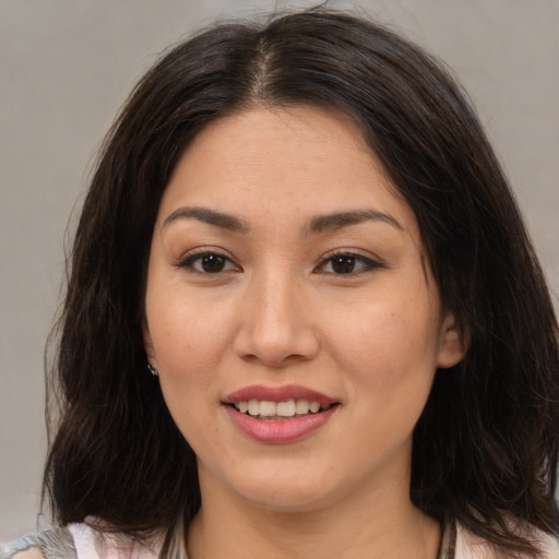 Joyful white young-adult female with medium  brown hair and brown eyes