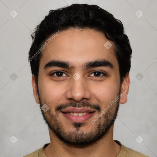 Joyful latino young-adult male with short  black hair and brown eyes