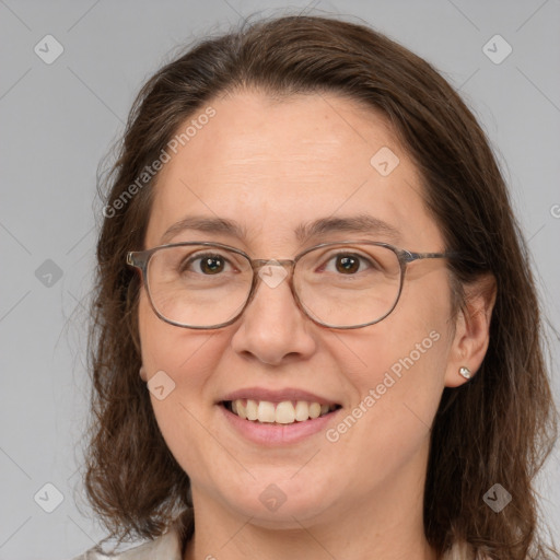 Joyful white adult female with medium  brown hair and grey eyes