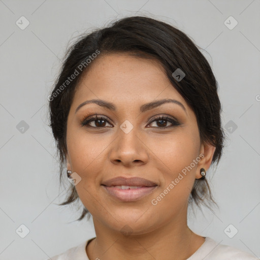 Joyful latino young-adult female with medium  brown hair and brown eyes