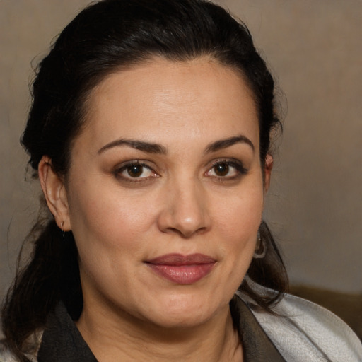 Joyful white adult female with medium  brown hair and brown eyes