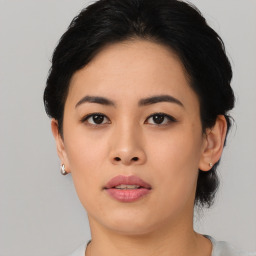 Joyful asian young-adult female with short  black hair and brown eyes