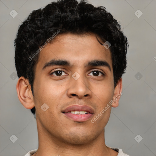 Joyful latino young-adult male with short  brown hair and brown eyes