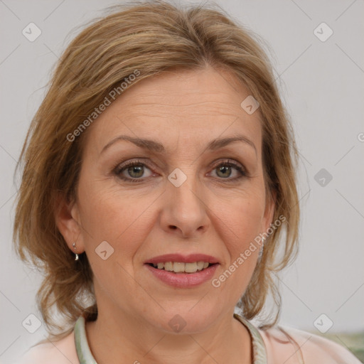 Joyful white adult female with medium  brown hair and brown eyes