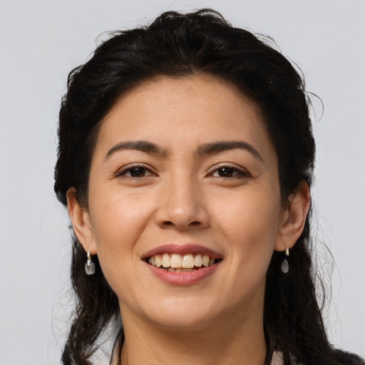 Joyful asian young-adult female with long  brown hair and brown eyes