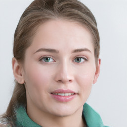 Joyful white young-adult female with medium  brown hair and blue eyes