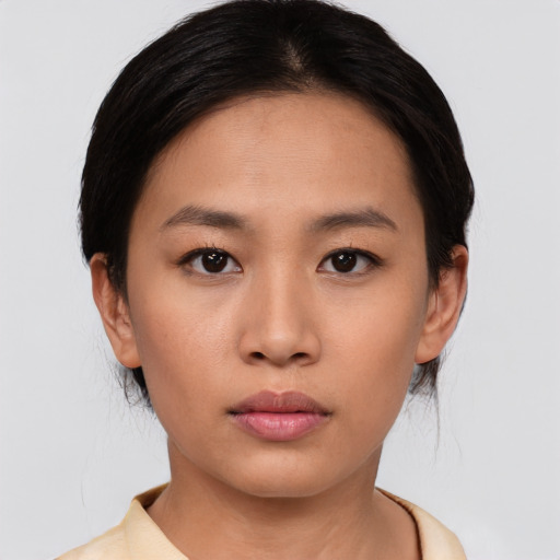Neutral asian young-adult female with medium  black hair and brown eyes