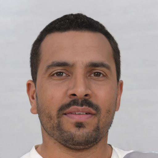 Neutral white young-adult male with short  black hair and brown eyes