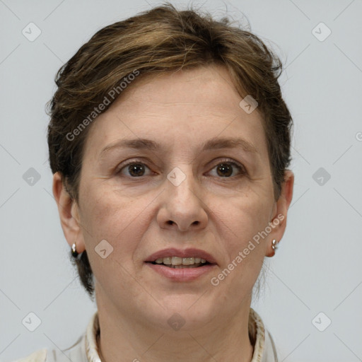 Joyful white adult female with short  brown hair and grey eyes