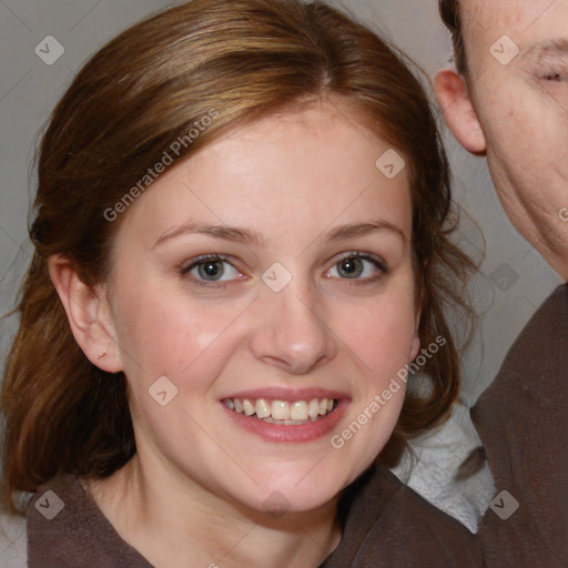 Joyful white young-adult female with medium  brown hair and blue eyes