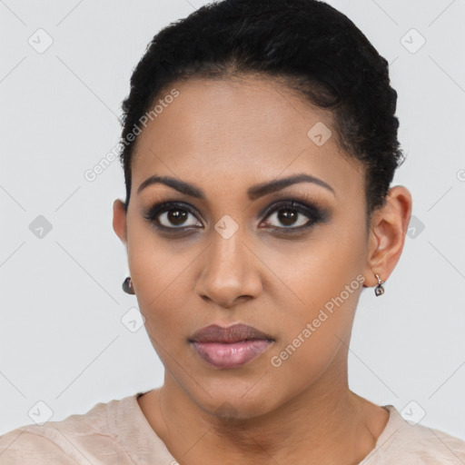 Joyful latino young-adult female with short  brown hair and brown eyes