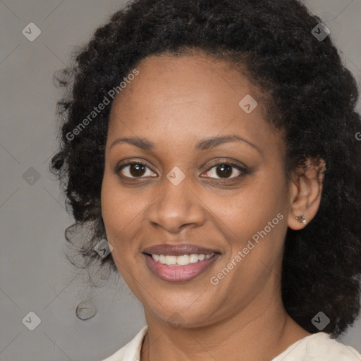 Joyful black young-adult female with medium  brown hair and brown eyes