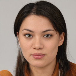 Joyful asian young-adult female with long  brown hair and brown eyes