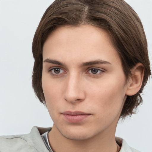 Neutral white young-adult female with medium  brown hair and brown eyes