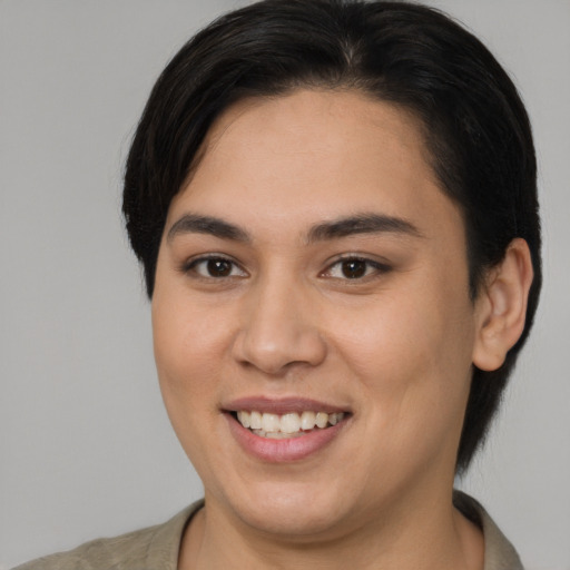 Joyful asian young-adult female with medium  brown hair and brown eyes