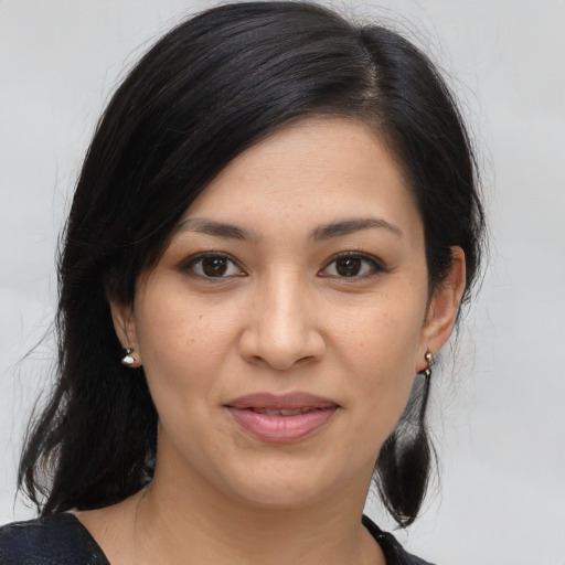 Joyful asian young-adult female with medium  brown hair and brown eyes