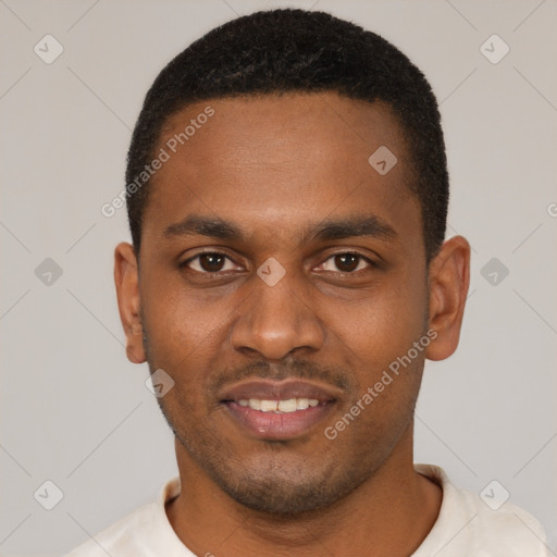 Joyful black young-adult male with short  black hair and brown eyes