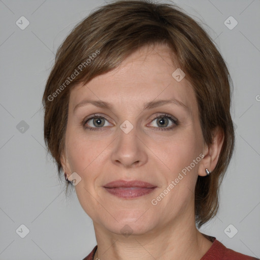 Joyful white adult female with medium  brown hair and grey eyes