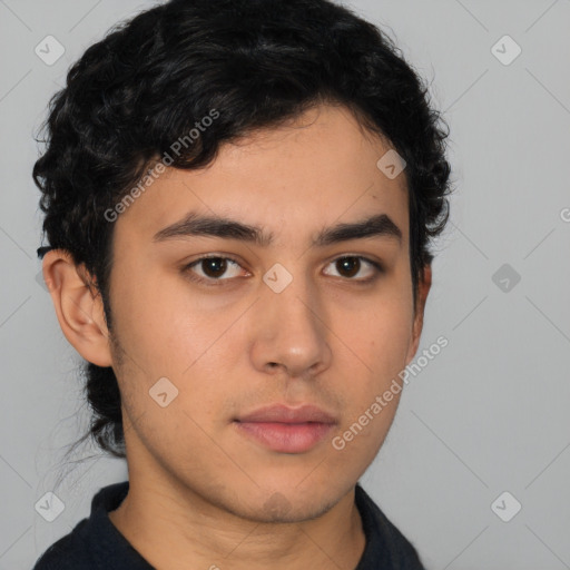 Neutral latino young-adult male with short  brown hair and brown eyes