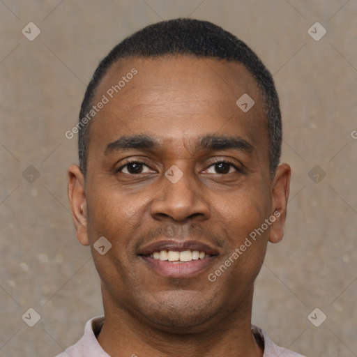 Joyful black young-adult male with short  black hair and brown eyes