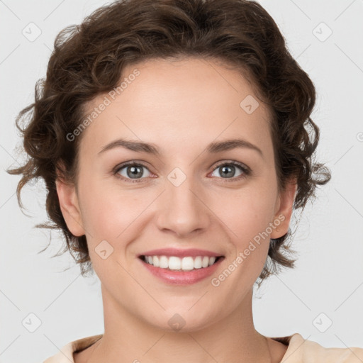 Joyful white young-adult female with medium  brown hair and green eyes