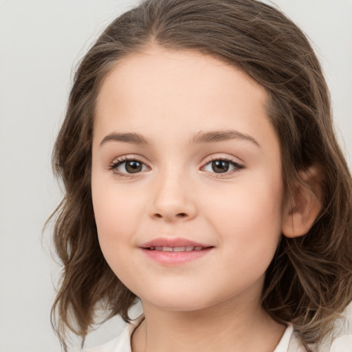 Joyful white child female with medium  brown hair and brown eyes