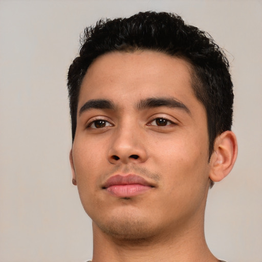 Neutral latino young-adult male with short  black hair and brown eyes