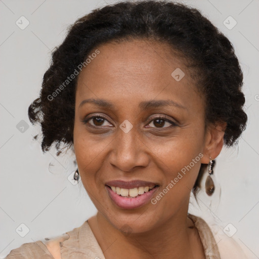 Joyful black adult female with medium  brown hair and brown eyes