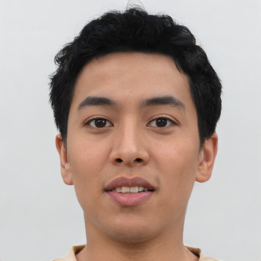 Joyful asian young-adult male with short  black hair and brown eyes