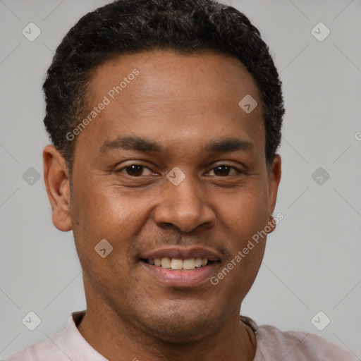 Joyful latino young-adult male with short  brown hair and brown eyes