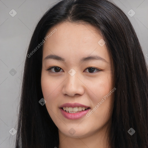 Joyful asian young-adult female with long  brown hair and brown eyes