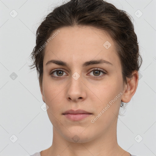 Neutral white young-adult female with short  brown hair and brown eyes