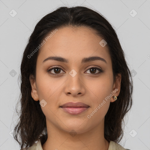 Joyful latino young-adult female with medium  brown hair and brown eyes