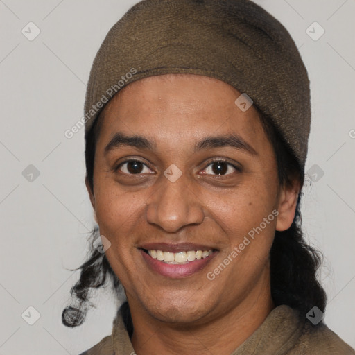 Joyful black adult female with short  brown hair and brown eyes